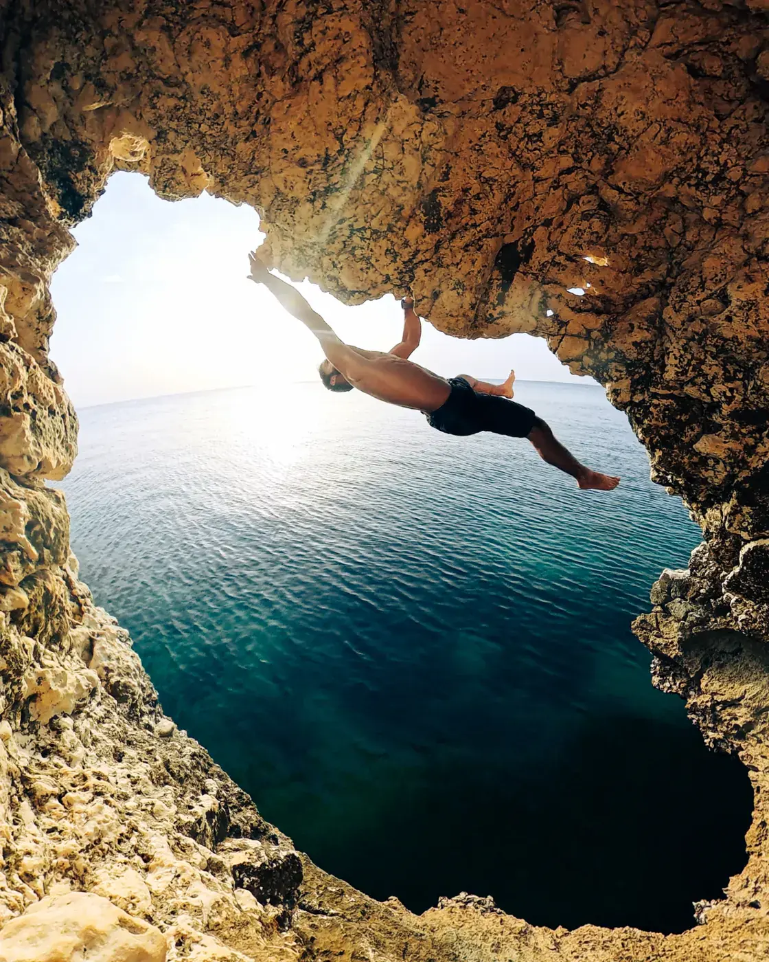 Deep Water Solo climbing from a boat in Oman